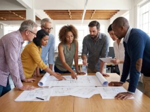 Diverse group of creatives collaborating around a table