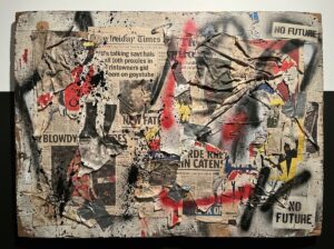 Textured mixed media artwork with torn paper and paint